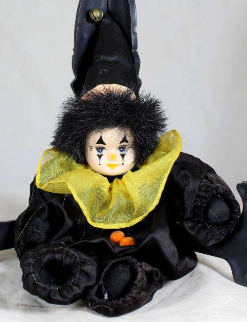 Pierrot clown in a black suit