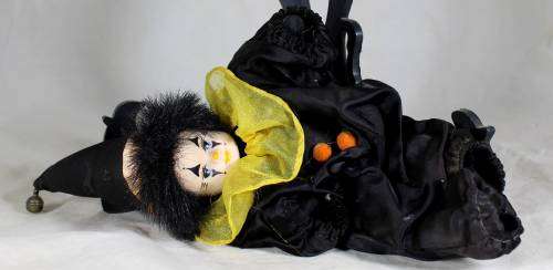 Pierrot clown in a black suit