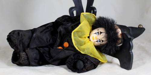 Pierrot clown in a black suit