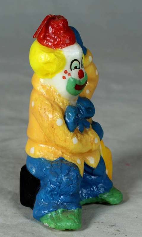 Orange and blue clown candle