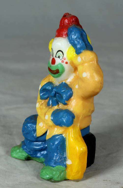 Orange and blue clown candle