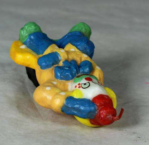 Orange and blue clown candle