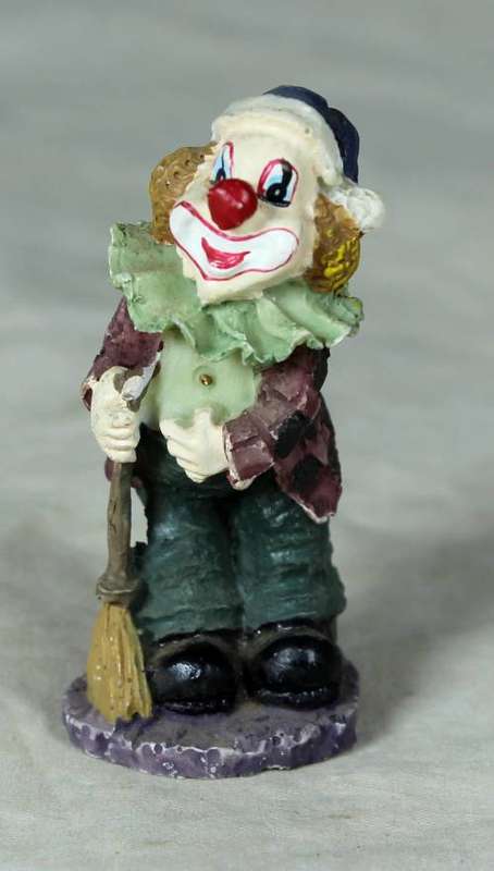 MOLDED CLOWN ON A STAND HOLDING A BROOM - BID NOW!!