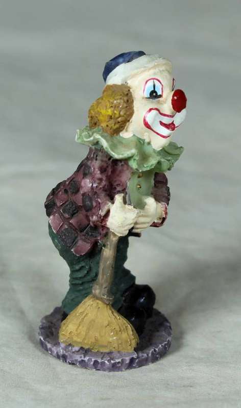 MOLDED CLOWN ON A STAND HOLDING A BROOM - BID NOW!!
