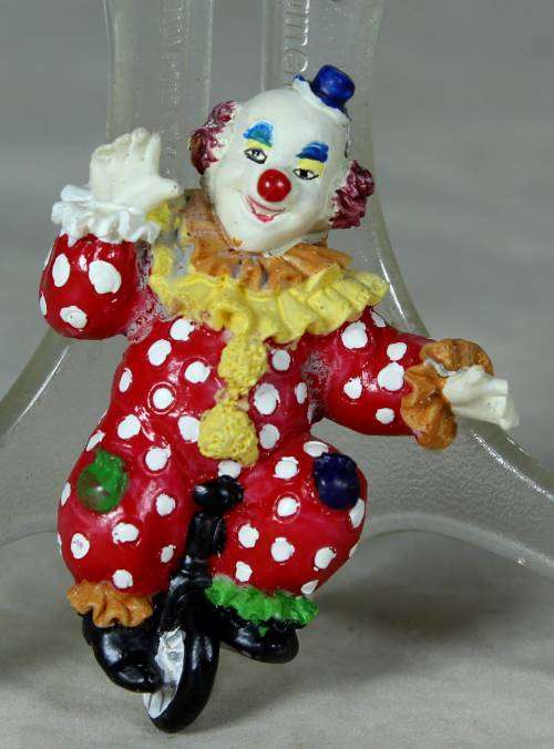 MOLDED CLOWN ON A UNICYCLE - BID NOW!!