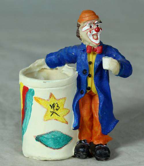 Molded clown holding a toothpick holder