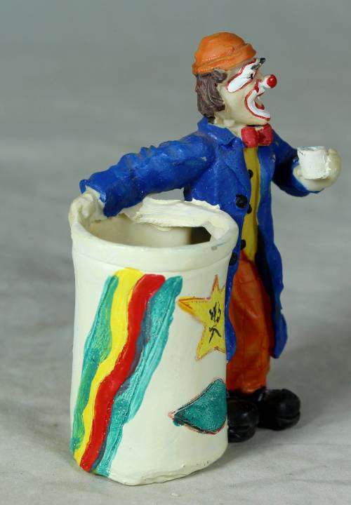 Molded clown holding a toothpick holder