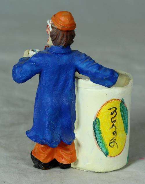 Molded clown holding a toothpick holder