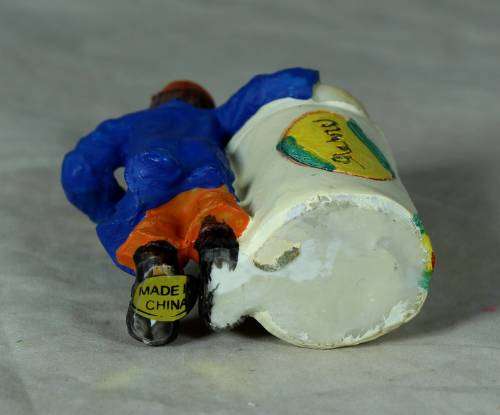 Molded clown holding a toothpick holder