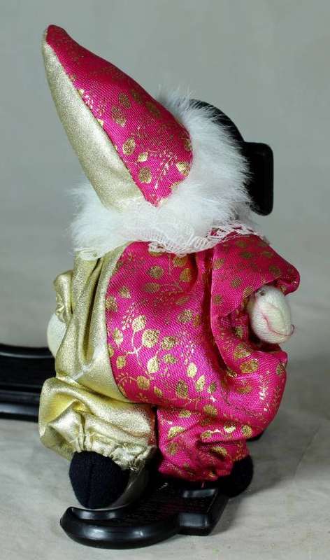 PORCERLAIN AND CLOTH  PIERRIOT IN A GOLD AND PINK SUIT
