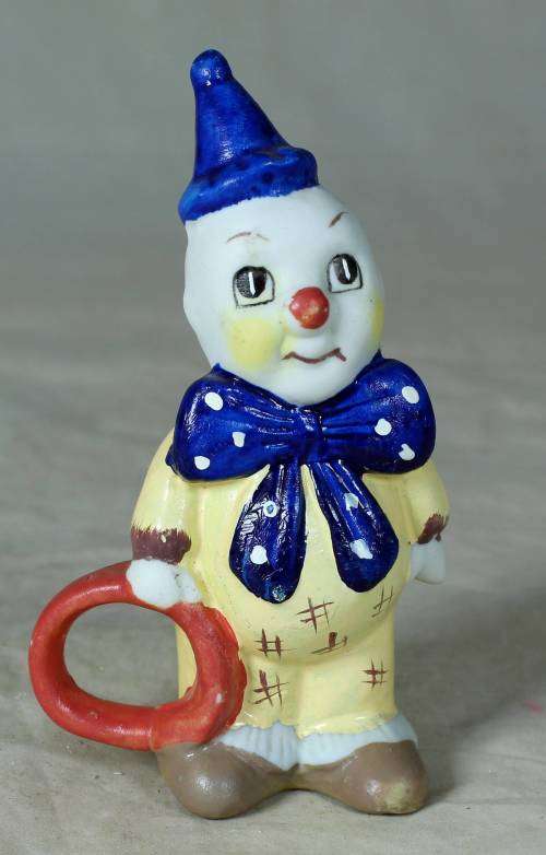 Ceramic clown holding a ring