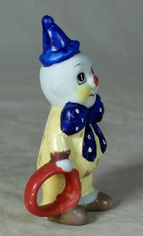 Ceramic clown holding a ring