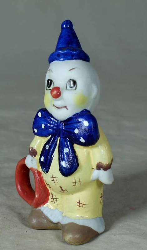 Ceramic clown holding a ring