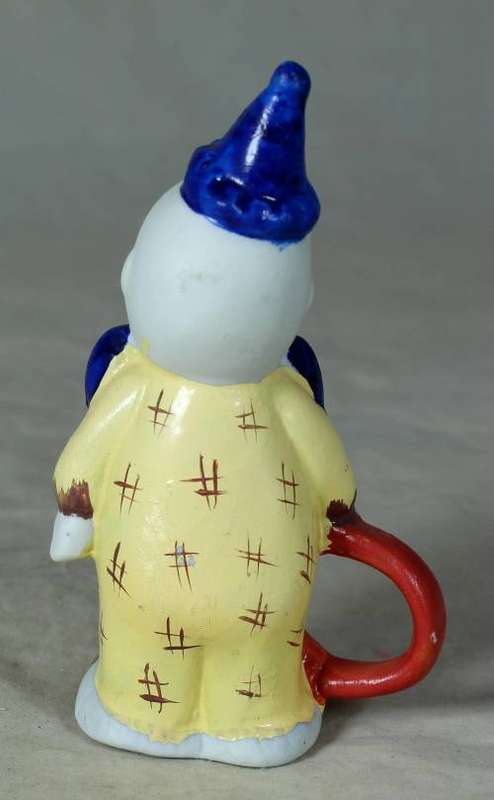 Ceramic clown holding a ring