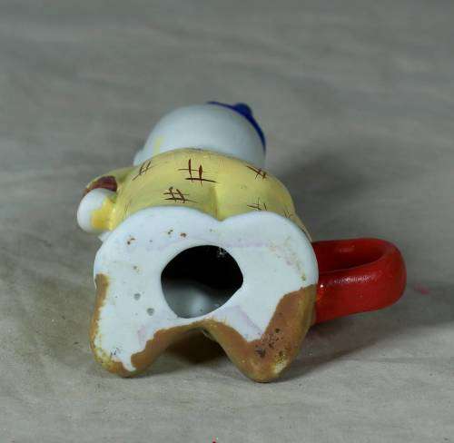 Ceramic clown holding a ring