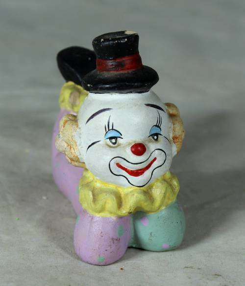 Ceramic clown laying down