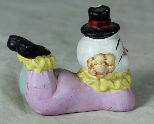 Ceramic clown laying down