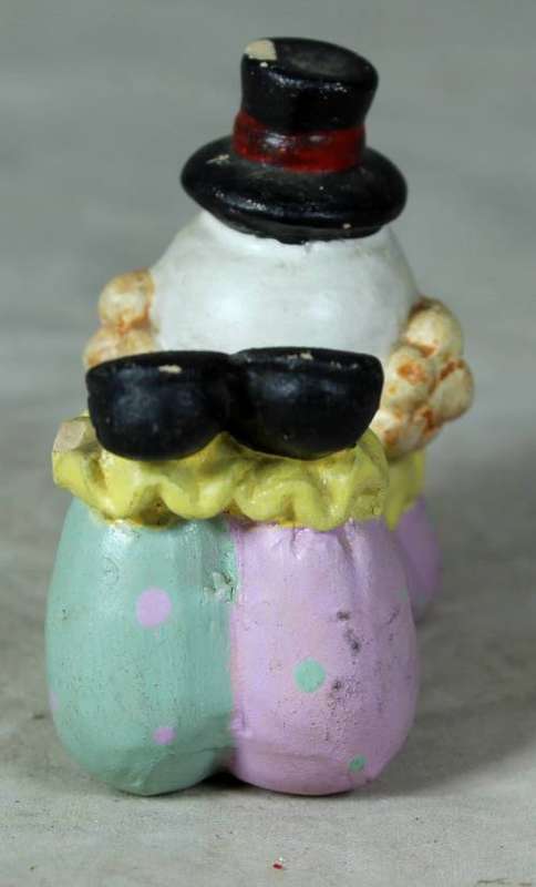 Ceramic clown laying down