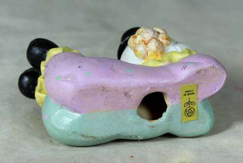 Ceramic clown laying down