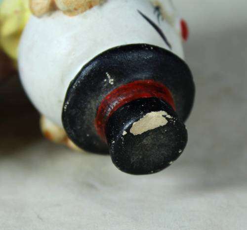 Ceramic clown laying down