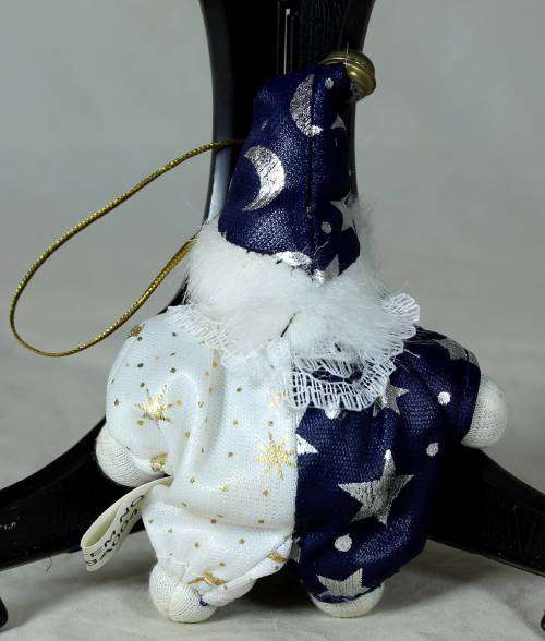porcelain and cloth clown dressed in a blue&white moon&stars outfit