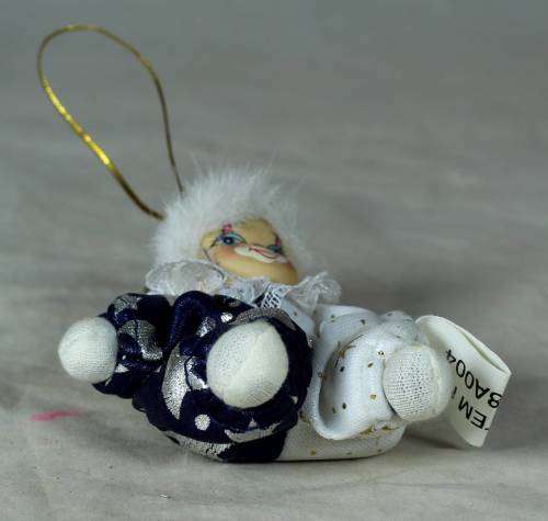 porcelain and cloth clown dressed in a blue&white moon&stars outfit