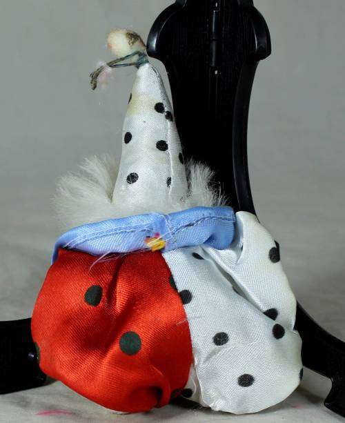porcelain and cloth clown with white hair