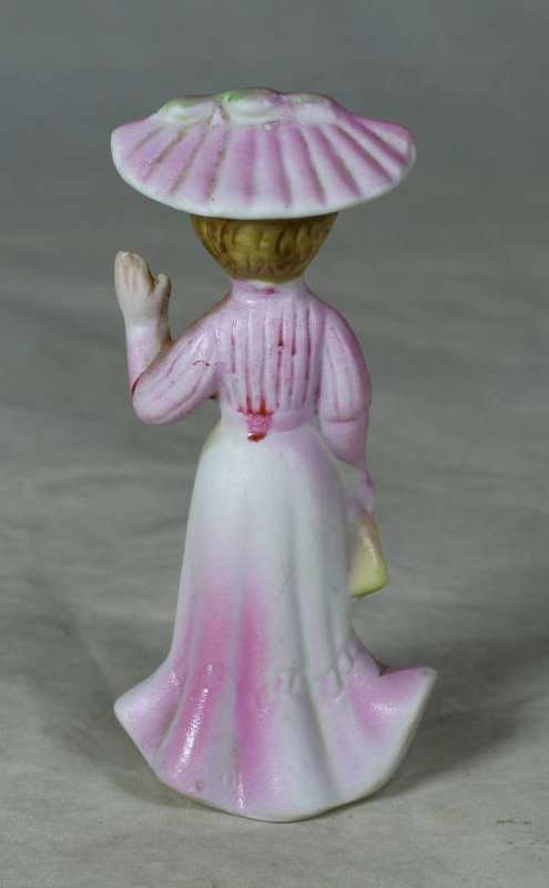 Ceramic Victorian lady waving