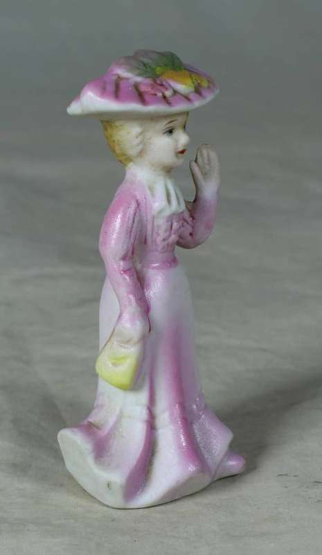 Ceramic Victorian lady waving