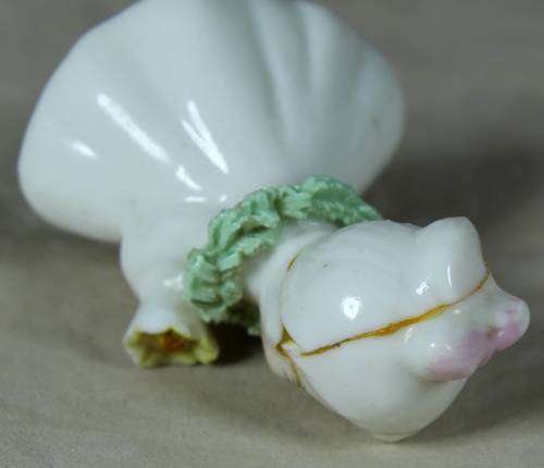 CERAMIC LITTLE GIRL HOLDING A BOUQUET OF FLOWERS