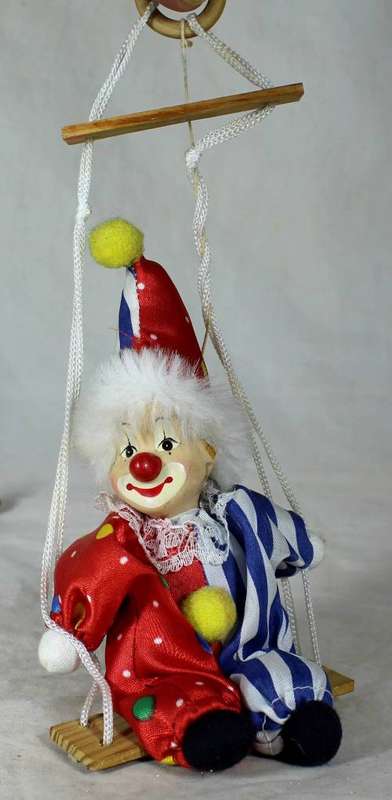 PORCERLAIN AND CLOTH CLOWN ON A ROPE - BID NOW!!