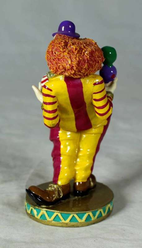 MOLDED CLOWN ON A STAND JUGGLING BALLS - BID NOW!!