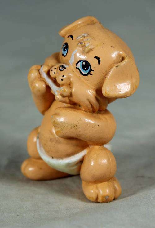 Nappy baby dog with a bone