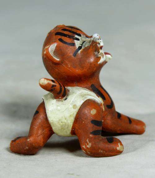 Nappy baby tiger with his bowl