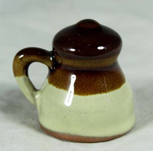 Miniature porcelain brown & beige milk jug
