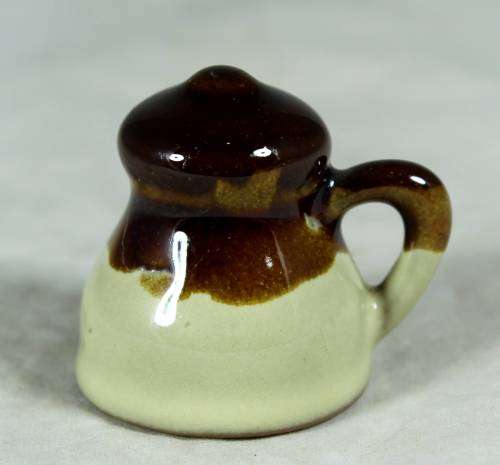 Miniature porcelain brown & beige milk jug