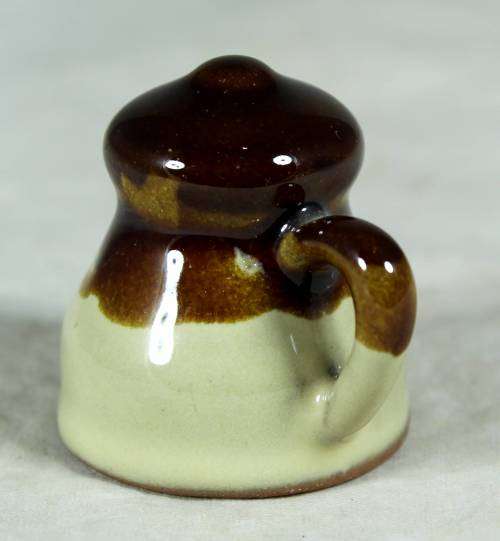 Miniature porcelain brown & beige milk jug