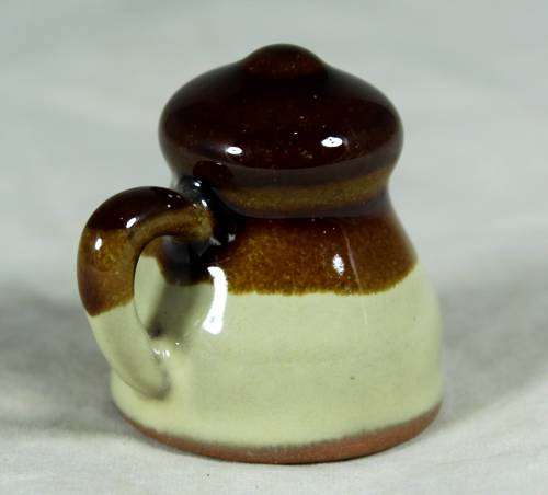 Miniature porcelain brown & beige milk jug