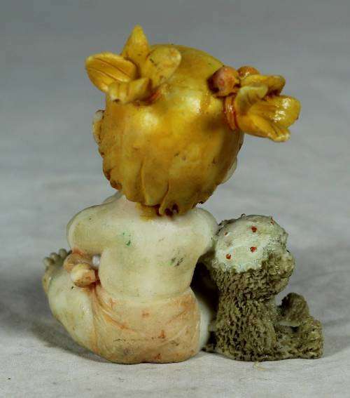 Ceramic little girl with her birthday cake