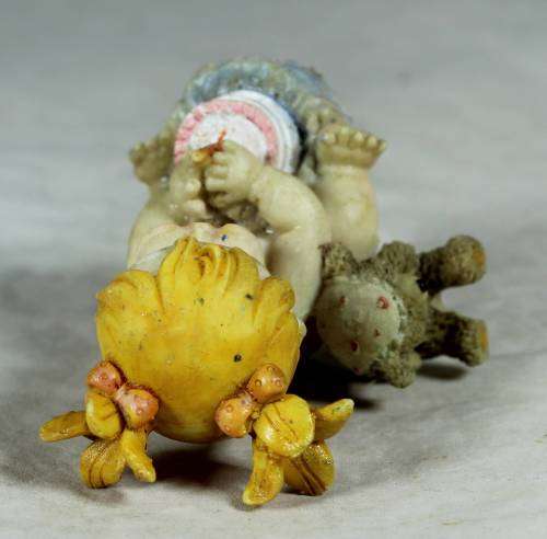 Ceramic little girl with her birthday cake