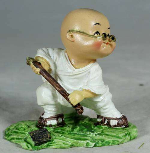 Kung Fu Buddha with a fighting stick