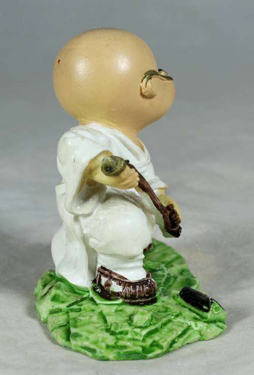 Kung Fu Buddha with a fighting stick