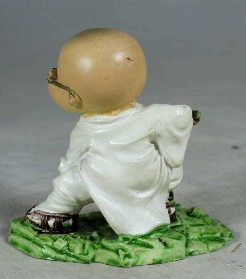 Kung Fu Buddha with a fighting stick