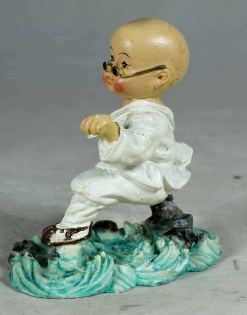 Kung Fu Buddha with eagle claw stand