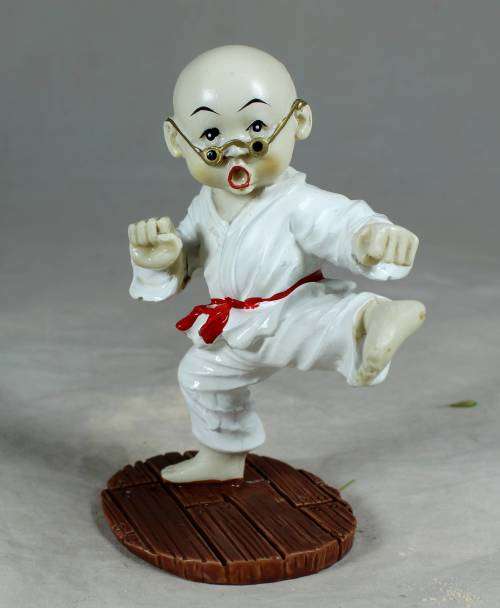 Kung Fu Buddha standing in a kicking position
