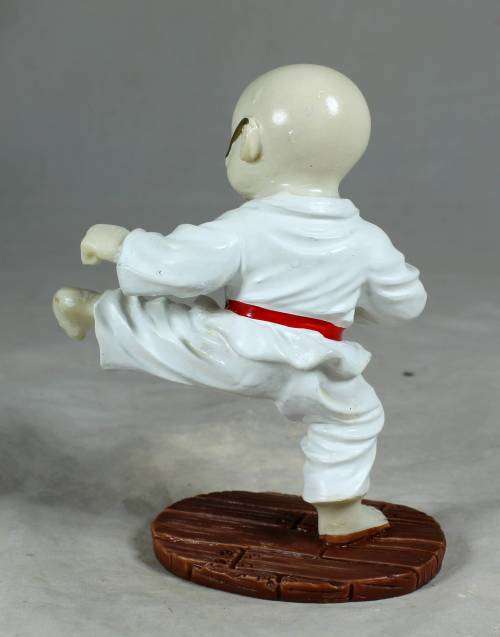 Kung Fu Buddha standing in a kicking position