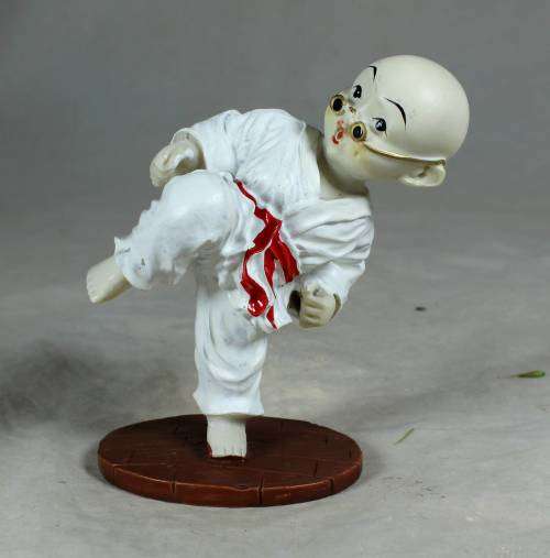 Kung Fu Buddha in a kicking position