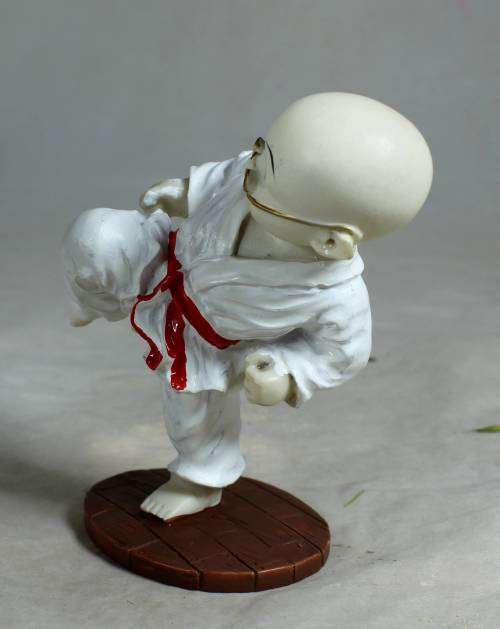 Kung Fu Buddha in a kicking position