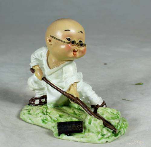 Kung Fu Buddha with a fighting stick