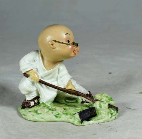 Kung Fu Buddha with a fighting stick
